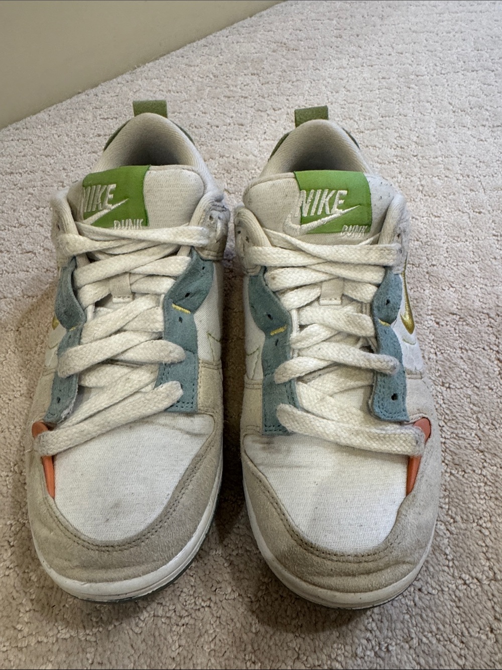 Nike Low-Top Sneakers in White with Green, Blue, and Orange Accents